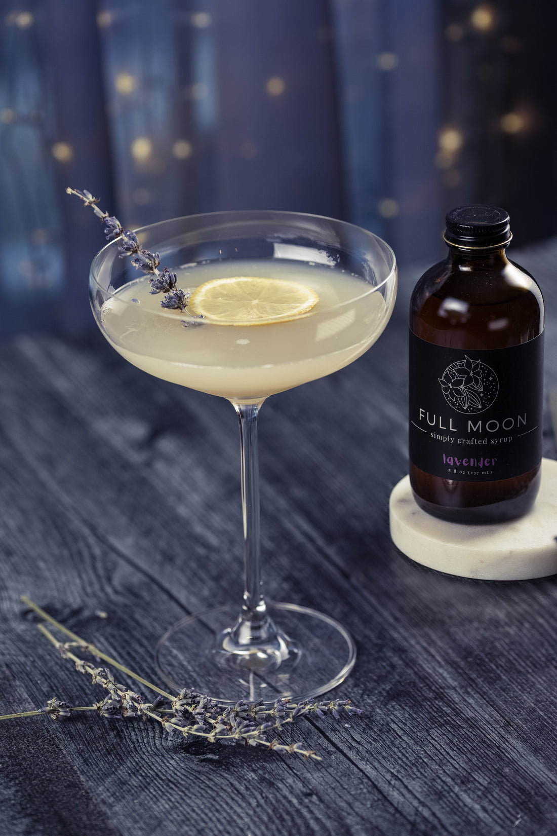 Lavender cocktail with dark blue starry background