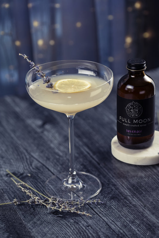Lavender cocktail with dark blue starry background
